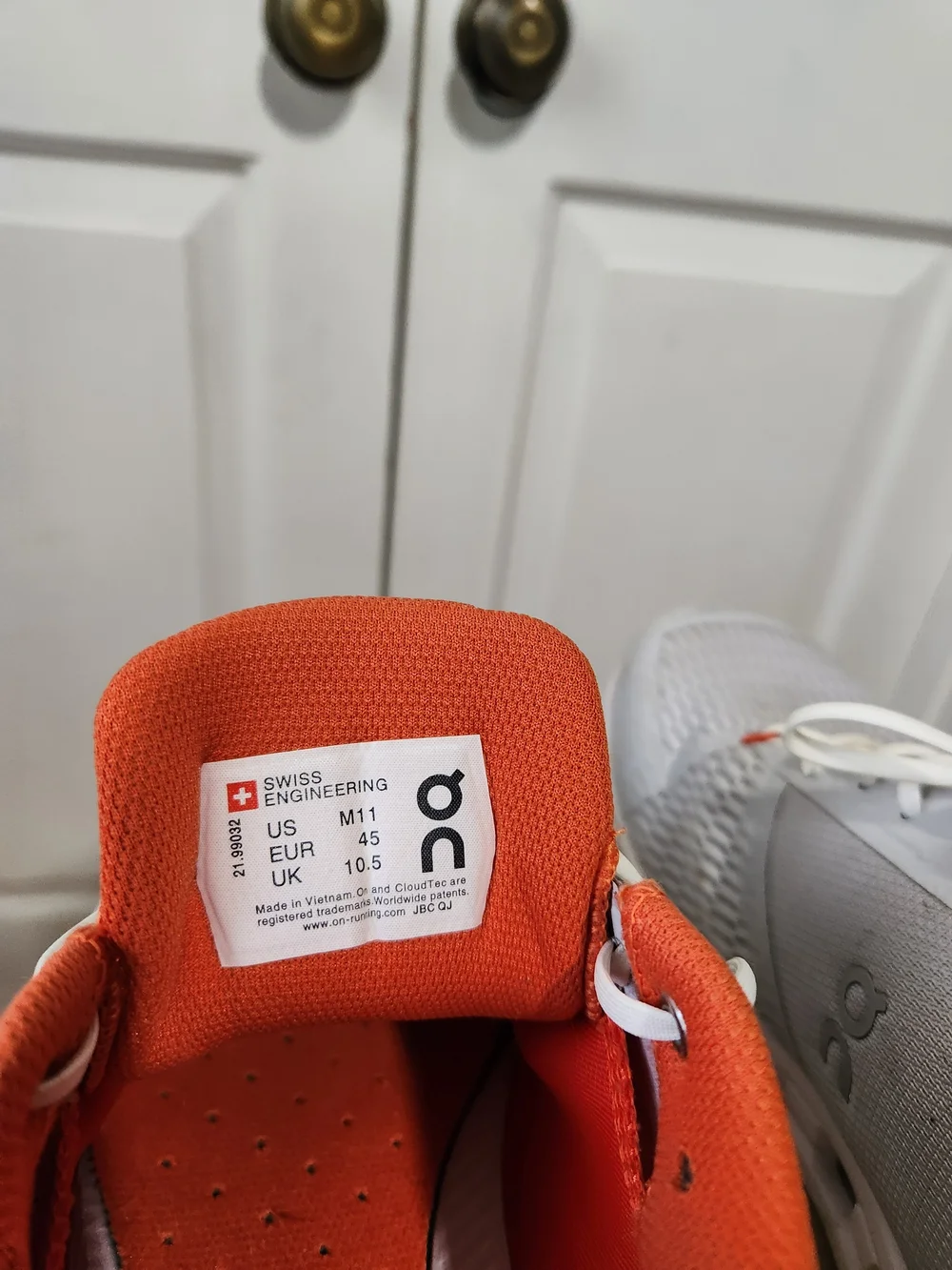 On Running Men’s White and Orange Cloudswift Running Shoes